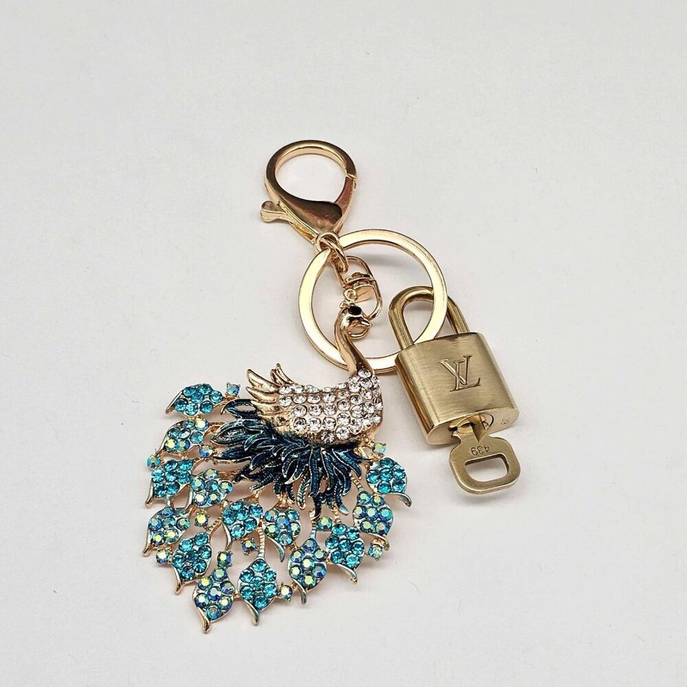 Authentic Louis Vuitton Lock & Key with unbranded Peacock Bagcharm, Keycharm